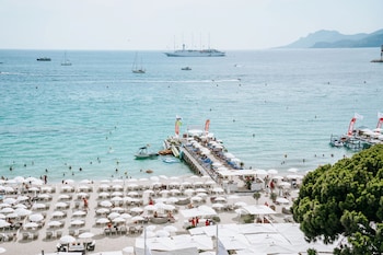 On the beach, sun loungers, beach umbrellas, beach towels