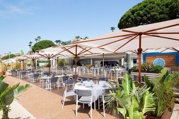 On the beach, sun loungers, beach umbrellas, beach towels