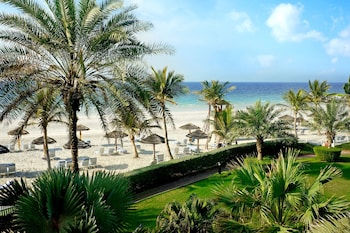 Private beach, white sand, sun loungers, beach umbrellas