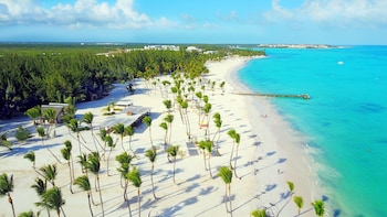 Private beach, white sand, free beach shuttle, beach umbrellas