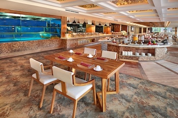 Breakfast, lunch, dinner served; international cuisine, pool views 