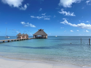 Private beach, white sand, sun loungers, beach umbrellas