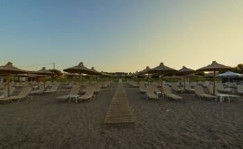 On the beach, sun loungers, beach umbrellas, beach towels
