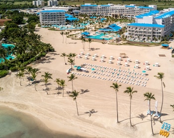 Private beach, white sand, sun loungers, beach umbrellas